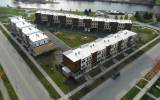 Three buildings of 33 luxury town home style apartments of Kingsbury Village